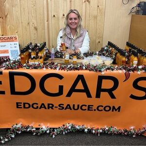 Edgar's Sauce Display with Orange Banner